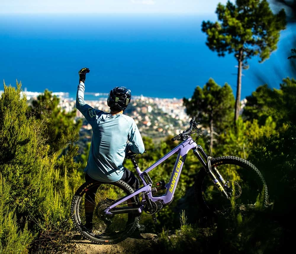 Luca sitting on the rear wheel of his 2021 Santa Cruz Bullit