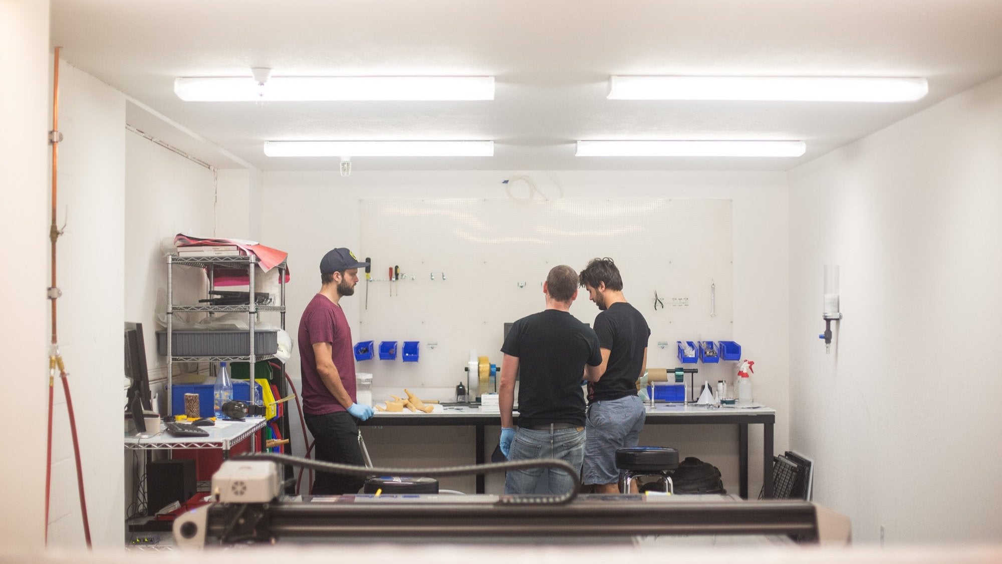 Workers in the Santa Cruz test lab analyzing a carbon fiber structure.