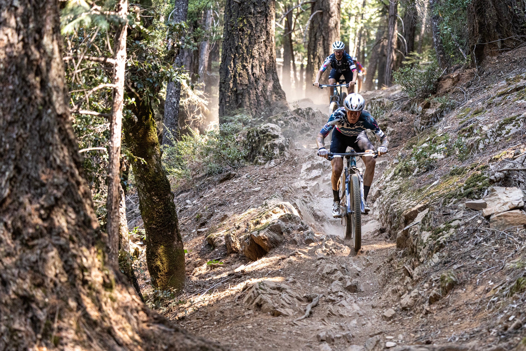 Keegan Swensen riding a Santa Cruz Blur down a technical rocky trail.