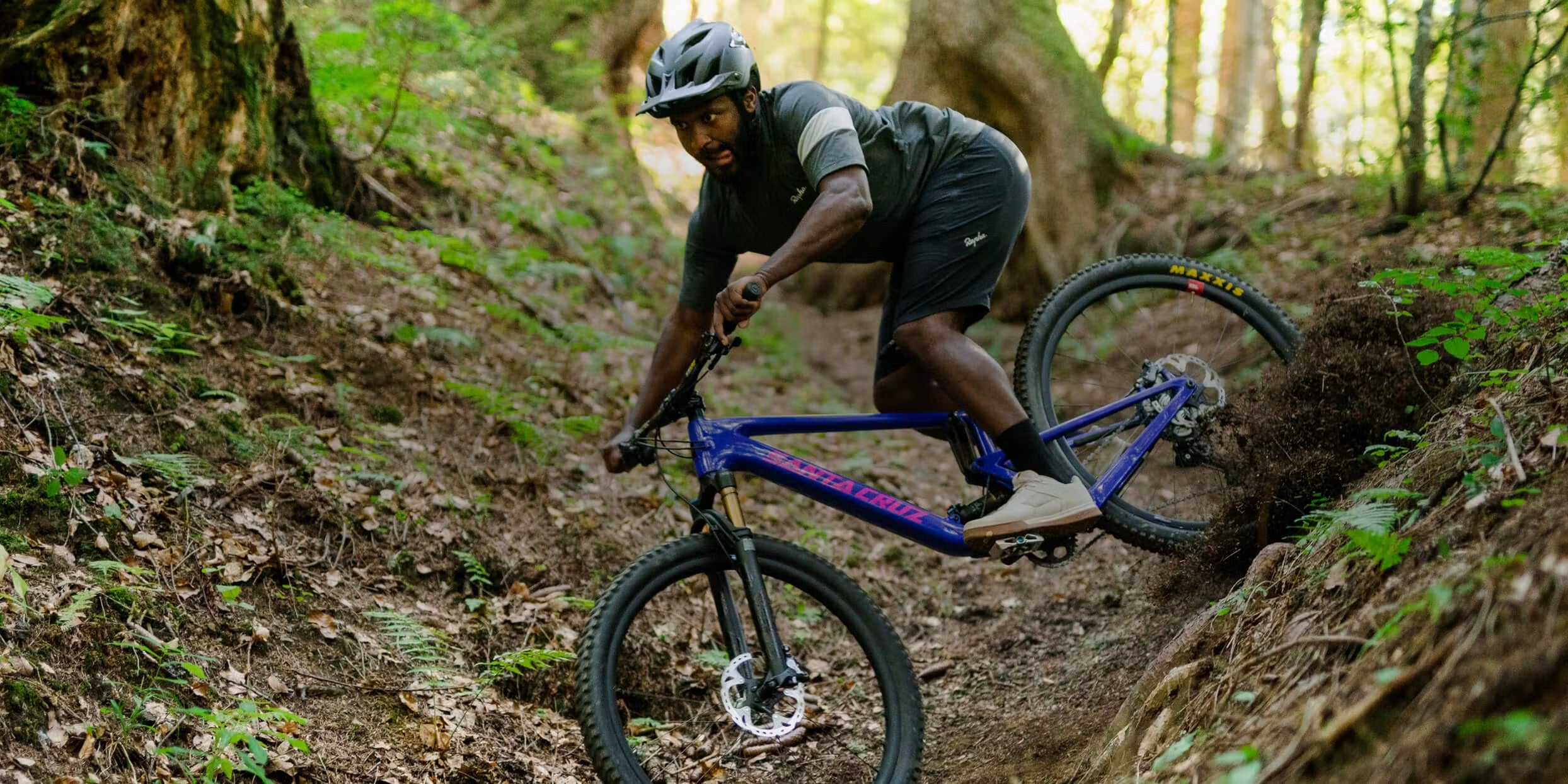 Elliot Jackson riding his Santa Cruz Tallboy down a loamy trail