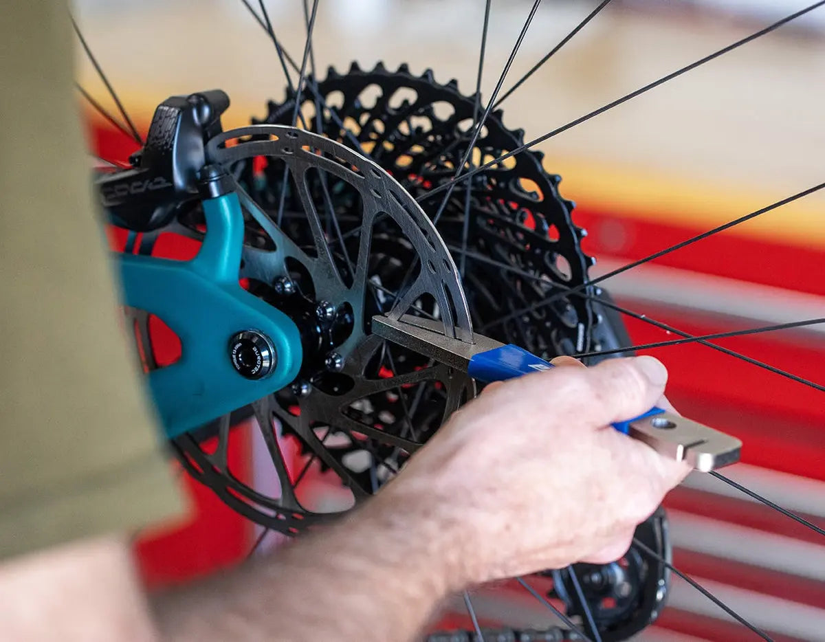 A mechanic truing a bent rotor