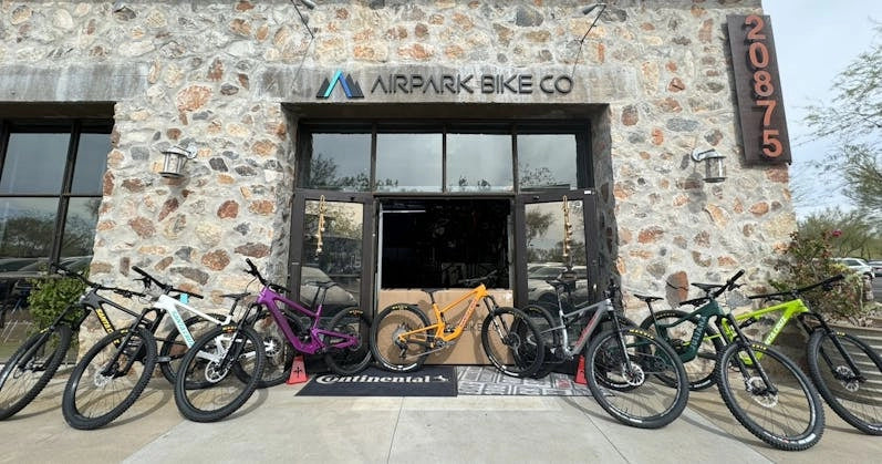 Airpark Bike Co. storefront showcasing a lineup of colorful Santa Cruz bicycles ready for riders