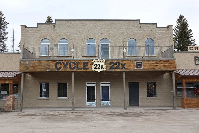 Cycle 22X storefront in Bragg Creek, featuring a historic building facade with wood accents and large signage