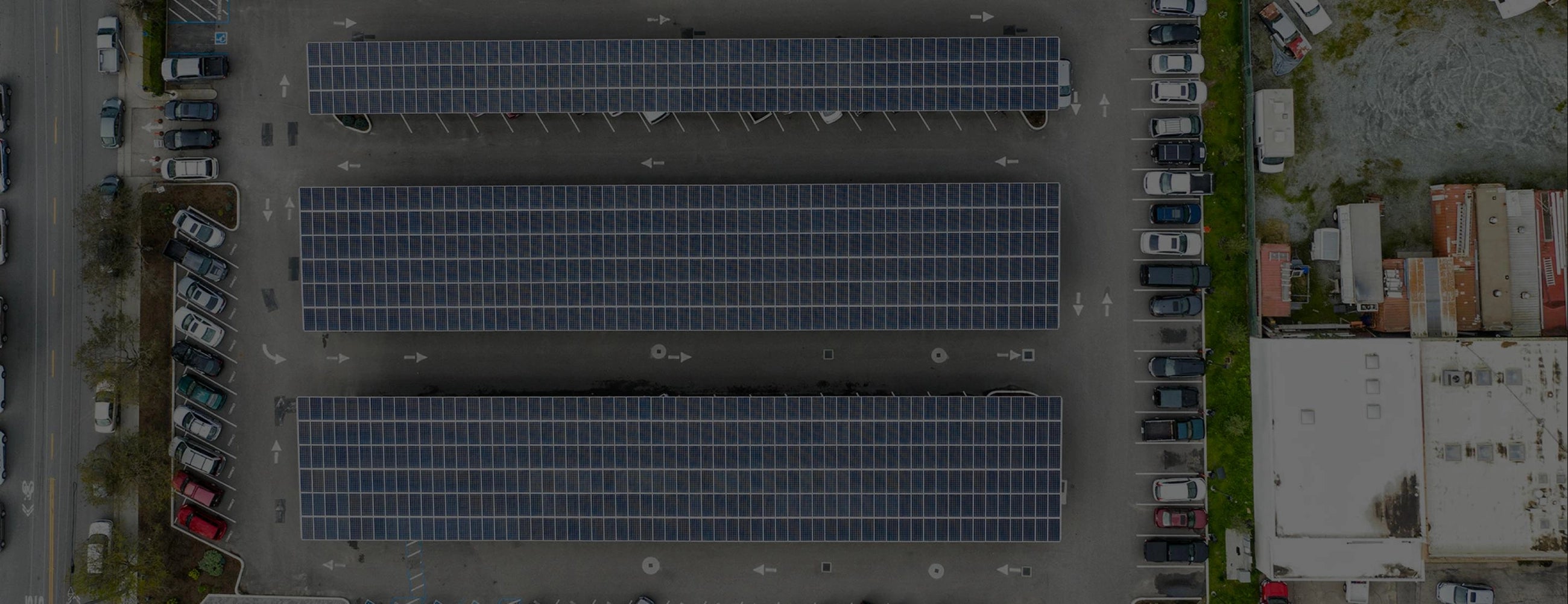 Aerial view of solar panel-covered parking structures showcasing a commitment to sustainability