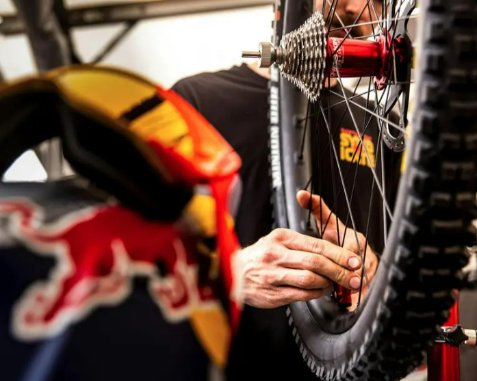 Mechanic truing a wheel