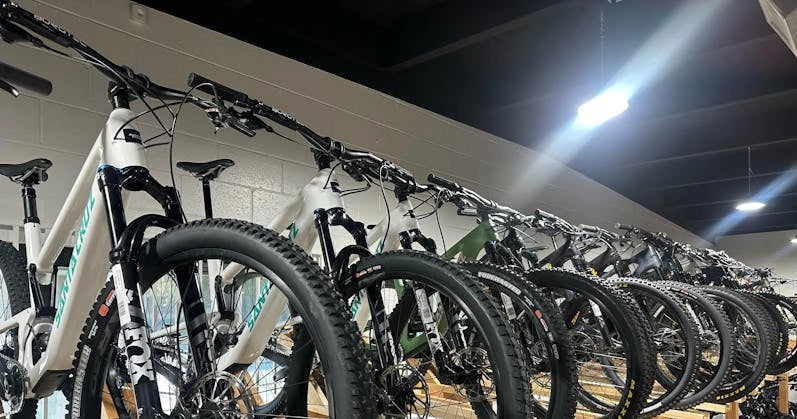 Showroom display of Santa Cruz bicycles featuring a lineup of sleek, high-performance models ready for trails