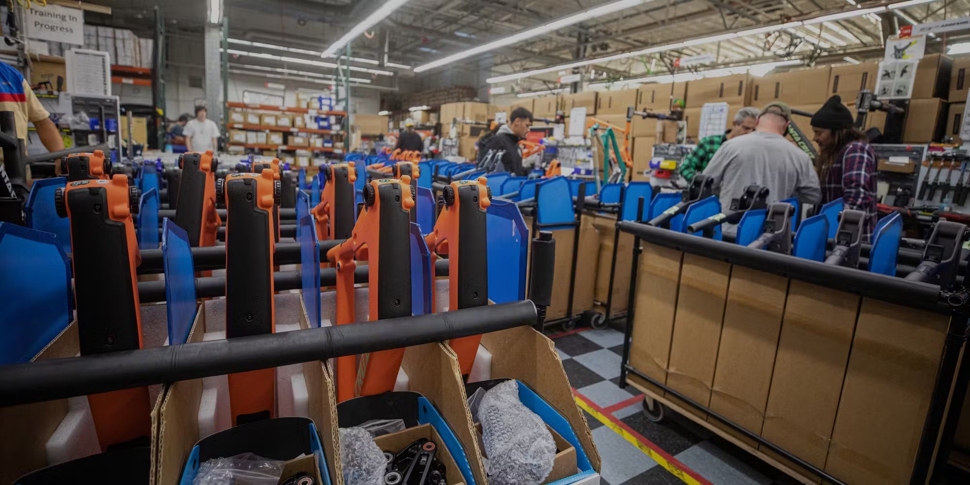 Factory showing workers working on bike 