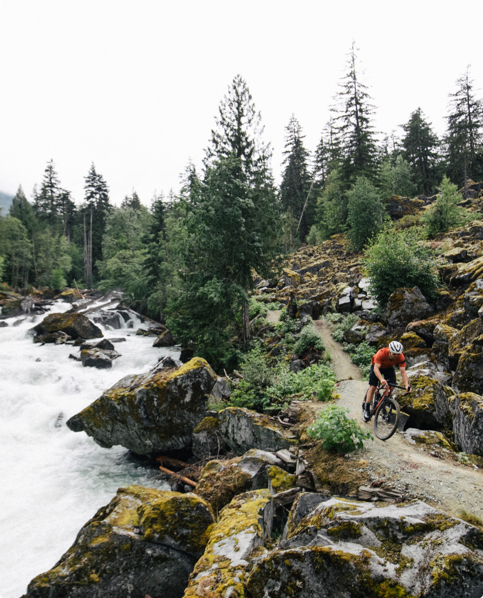 Rider on gravel trail by river