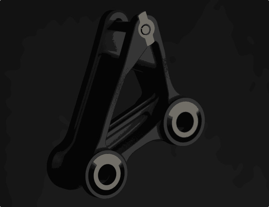 A close-up view of a sleek bike suspension linkage component with a modern, minimalistic design on a dark background